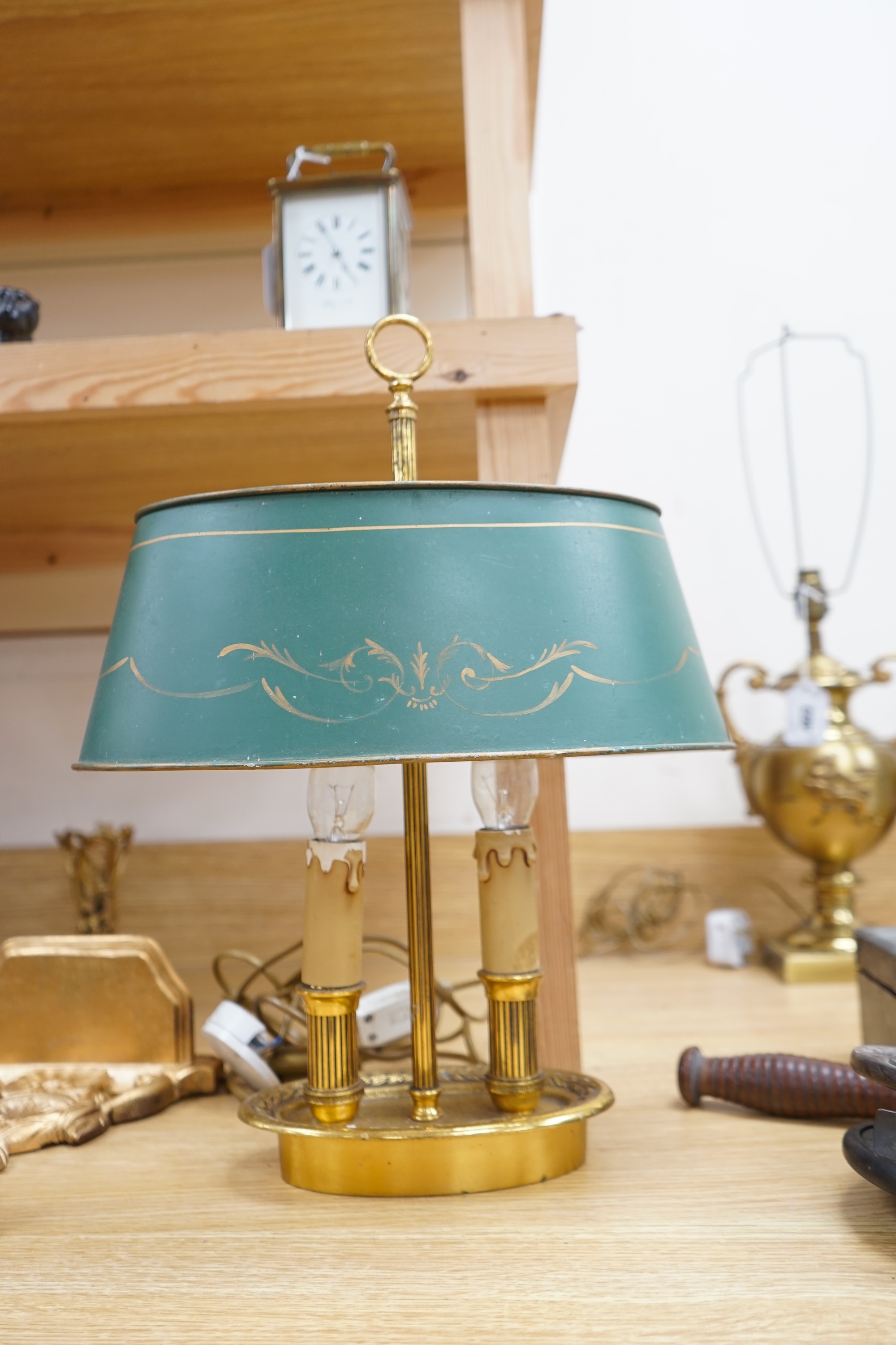 A French two light brass table lamp with toleware shade, 42cm high. Condition - some ware to toleware shade